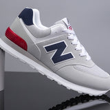 Ténis NB® - Cinza / Azul